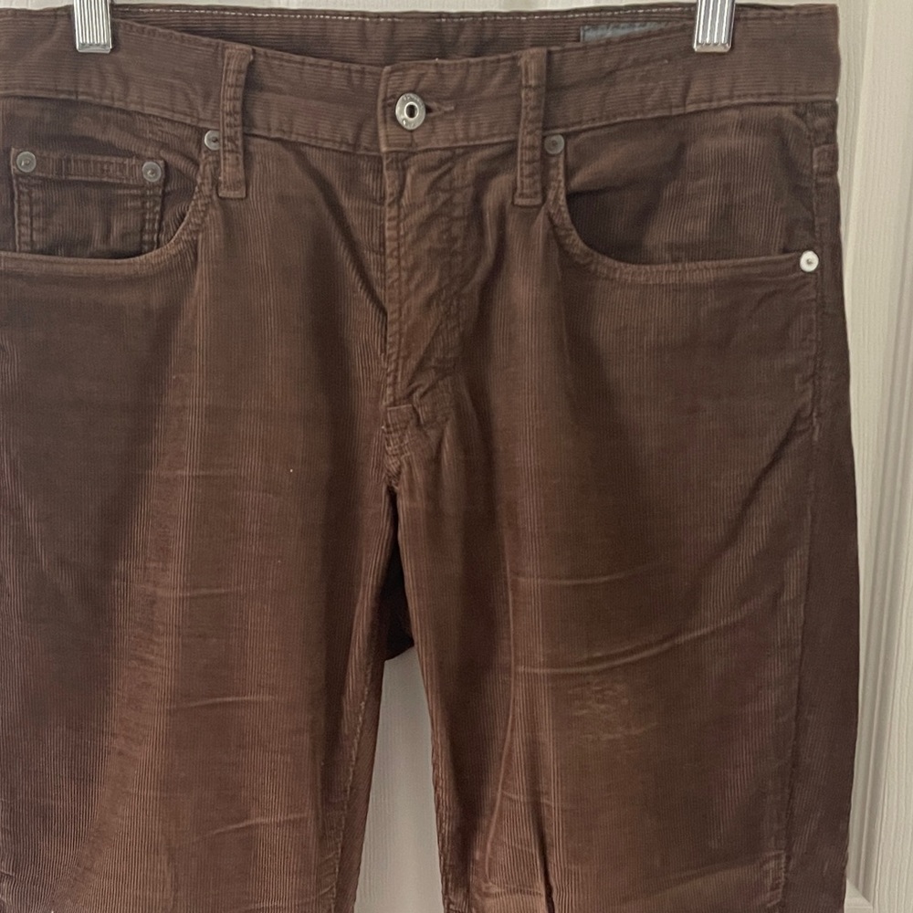 Brown corduroy pants, 98% cotton and 2% elastase for stretch comfort.